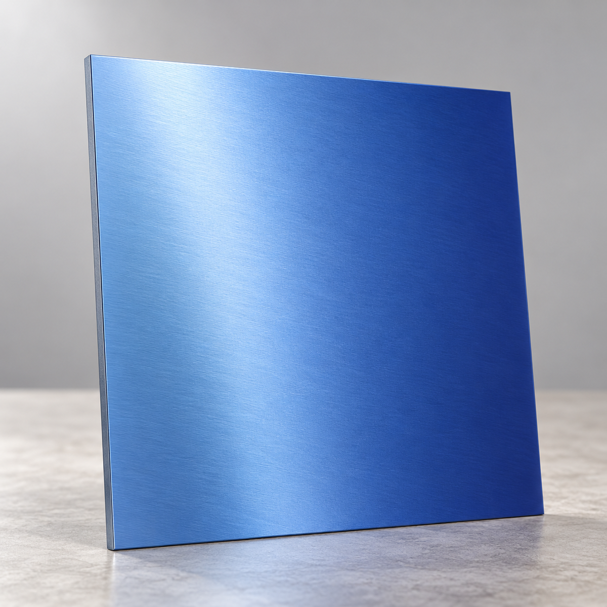 Blue Metallics illustrative sample chip standing on edge under overhead lighting, showing a reflective brushed finish.