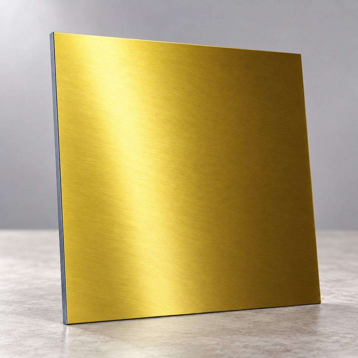 Gold Metallics illustrative sample chip under overhead lighting, showing a reflective brushed finish.
